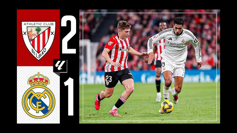 Cầu thủ của Athletic Bilbao đang nỗ lực giữ bóng khỏi sự áp đảo của cầu thủ Real Madrid Cầu thủ của Athletic Bilbao đang nỗ lực giữ bóng khỏi sự áp đảo của cầu thủ Real Madrid